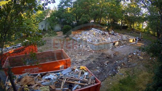 Demolition debris with dumpsters during a post-demolition clean-out